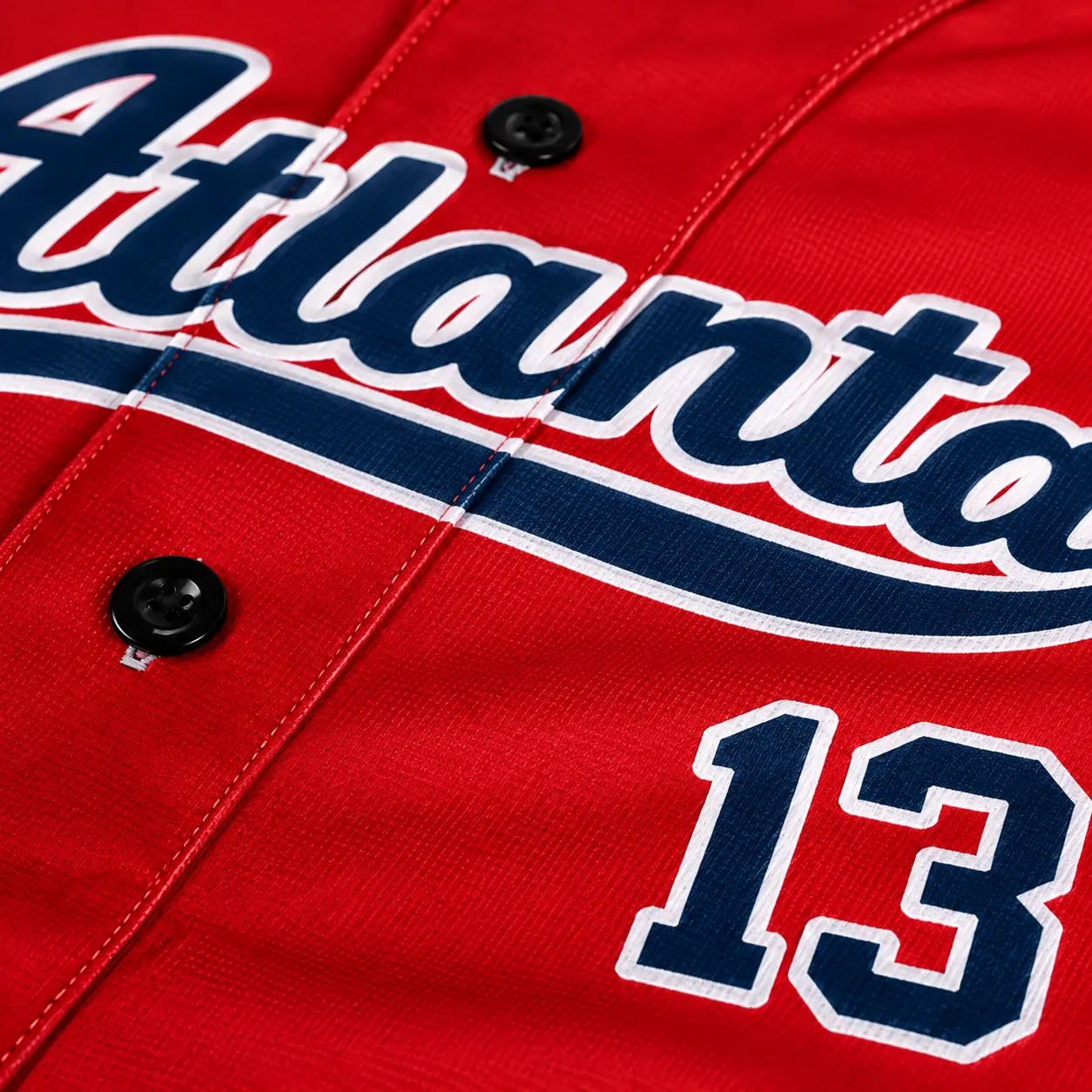 Custom baseball jersey close-up of printed script lettering and number